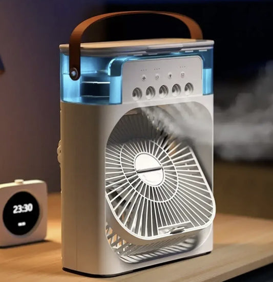 Portable fan with a wooden handle on a table next to a clock.